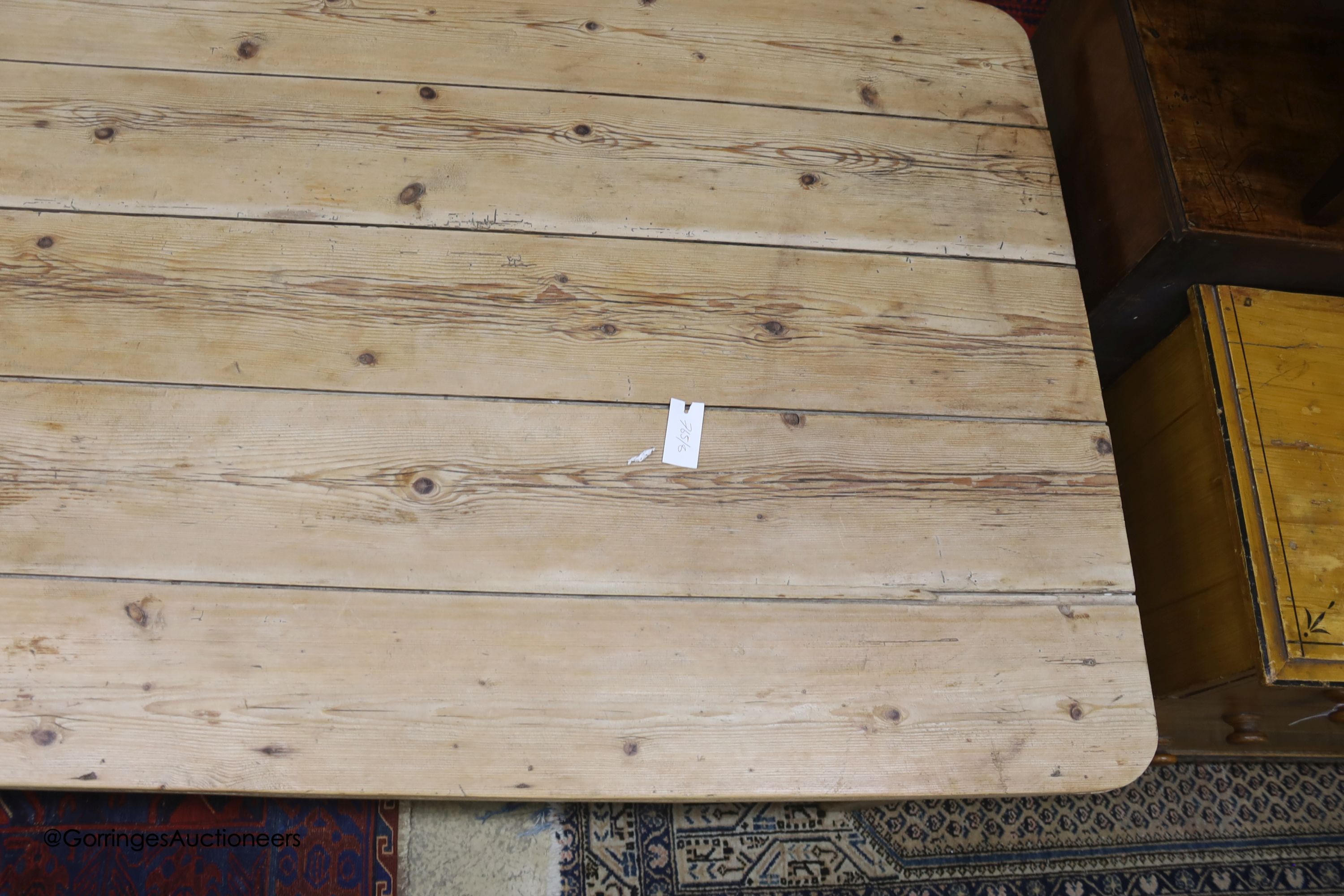 A 19th century rectangular pine plank top farmhouse kitchen table, length 211cm, depth 98cm, height 75cm
